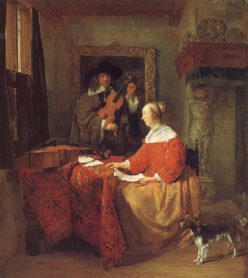 A Woman Seated at a Table and a Man Tuning a Violin